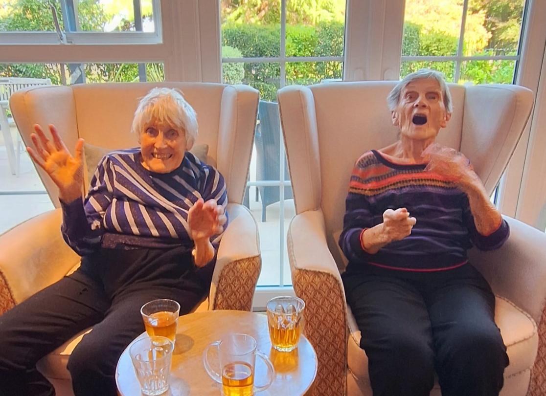 2 Fairmile Grange residents enjoying Sandra's piano playing