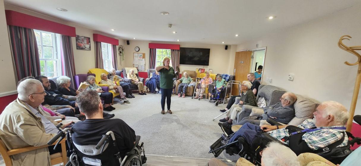 Residents at Magdalen House enjoy a visit from Lavenham Falconry birds of prey