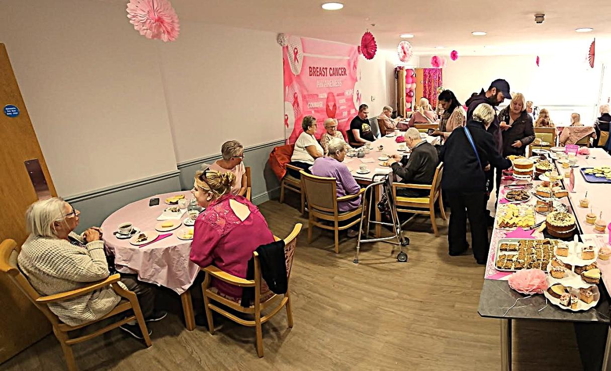 Residents, visitors and the team at Magdalen House for Breast cancer Awareness Day