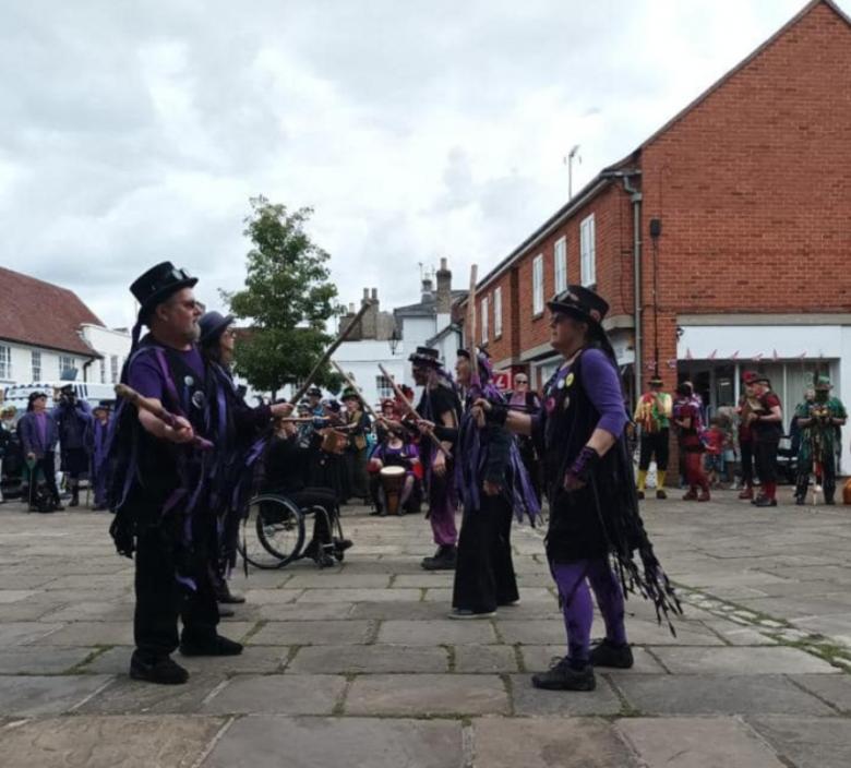 image of morris dancers in Hadleigh town with a crowd around