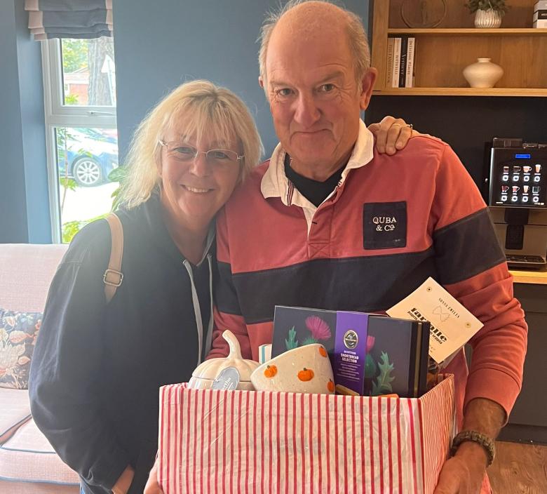 Sue and Brett with their winning prize