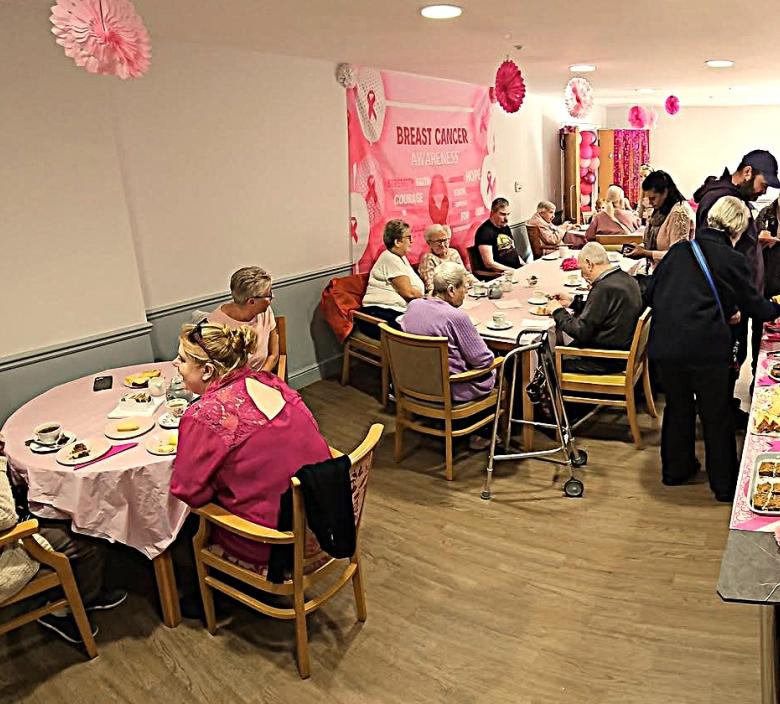 Residents, visitors and the team at Magdalen House for Breast cancer Awareness Day
