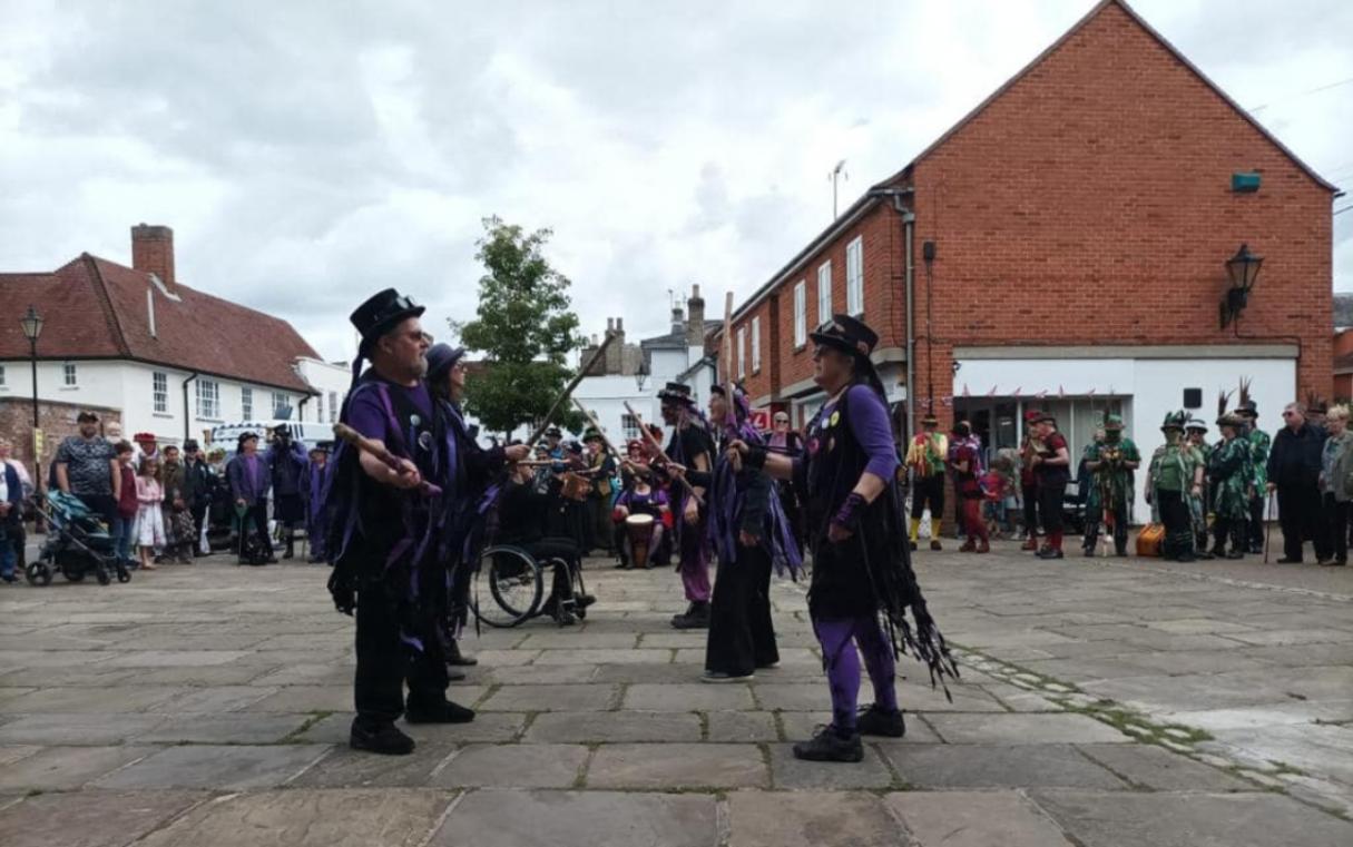 image of morris dancers in Hadleigh town with a crowd around