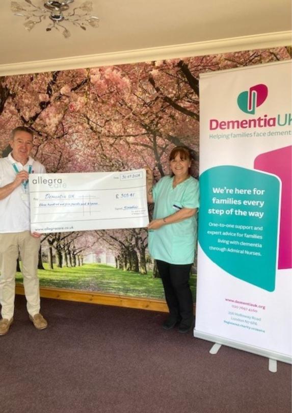 Handing over the large cheque to Dementia UK