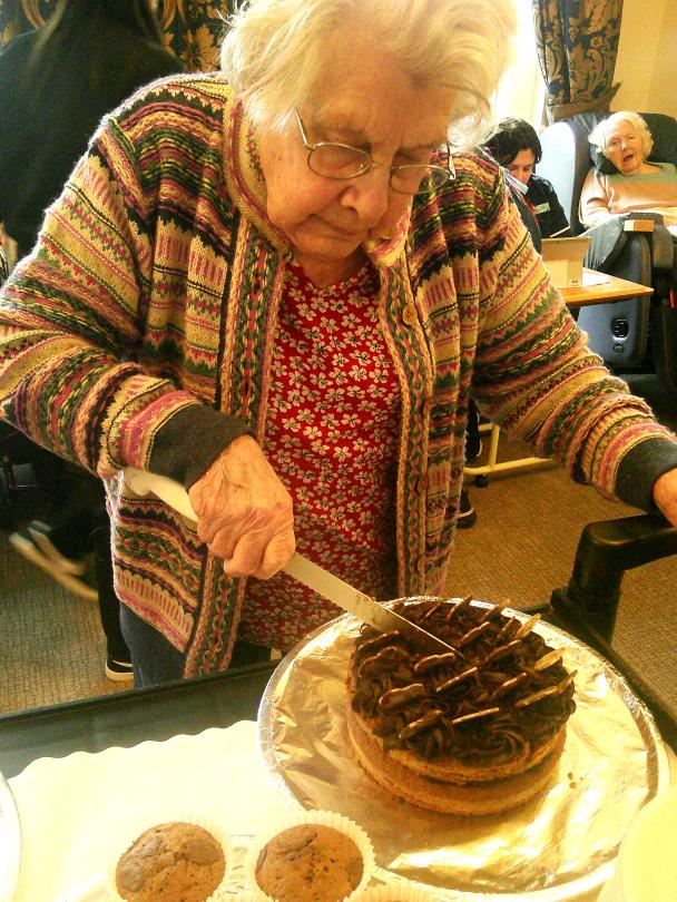 Resident enjoying sampling one of the chocolate cakes