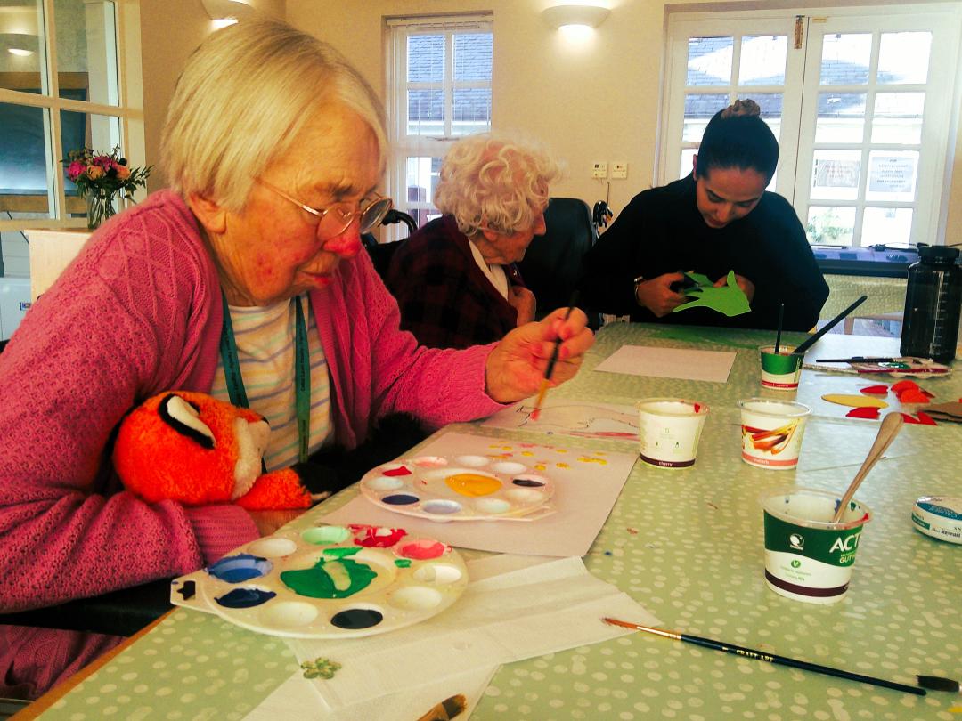 Cedar Lawn Residents enjoying arts and crafts with Meha