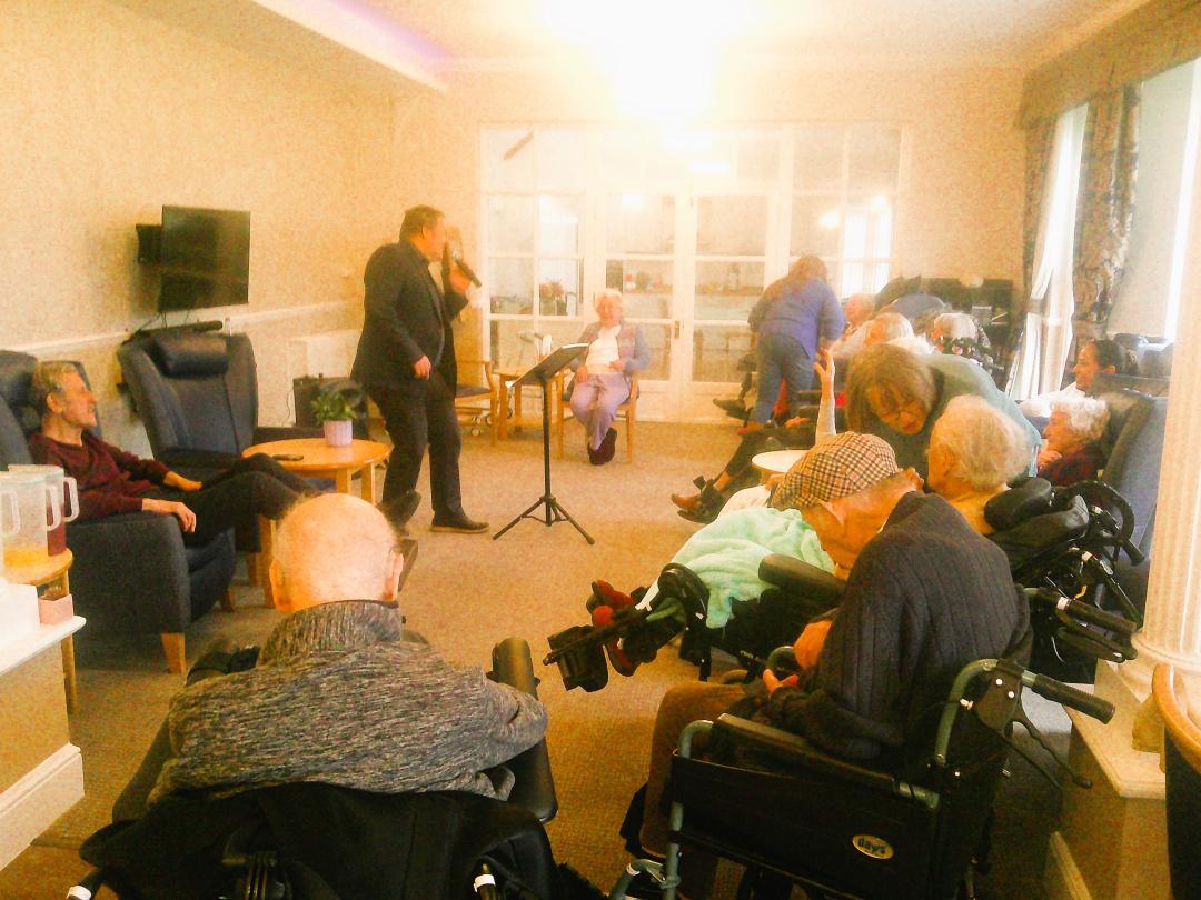 Mark Bourne entertaining Cedar Lawn residents