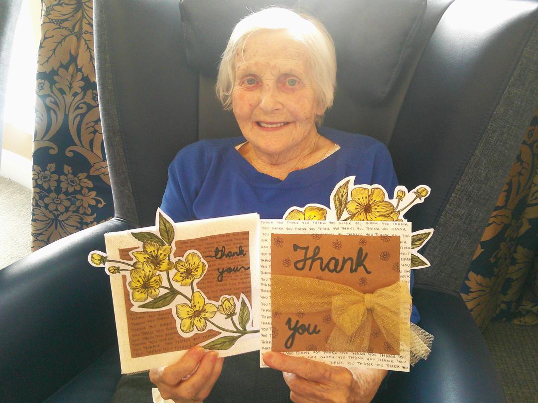 Cedar Lawn Resident showing her craft work for the local GP