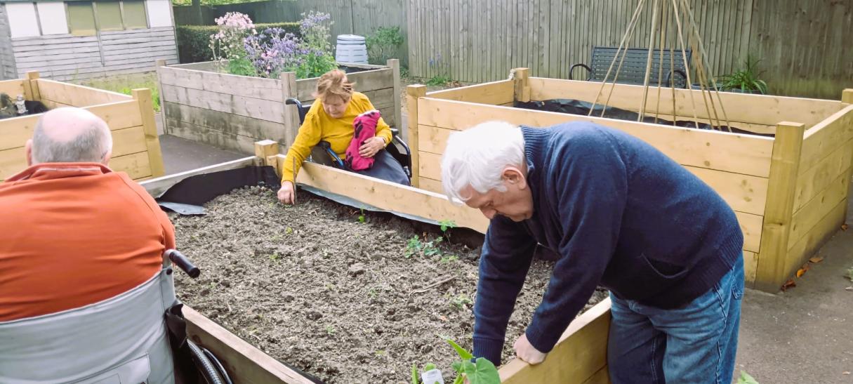 Residents planting vegetable and flowers at Fordingbridge Care Home