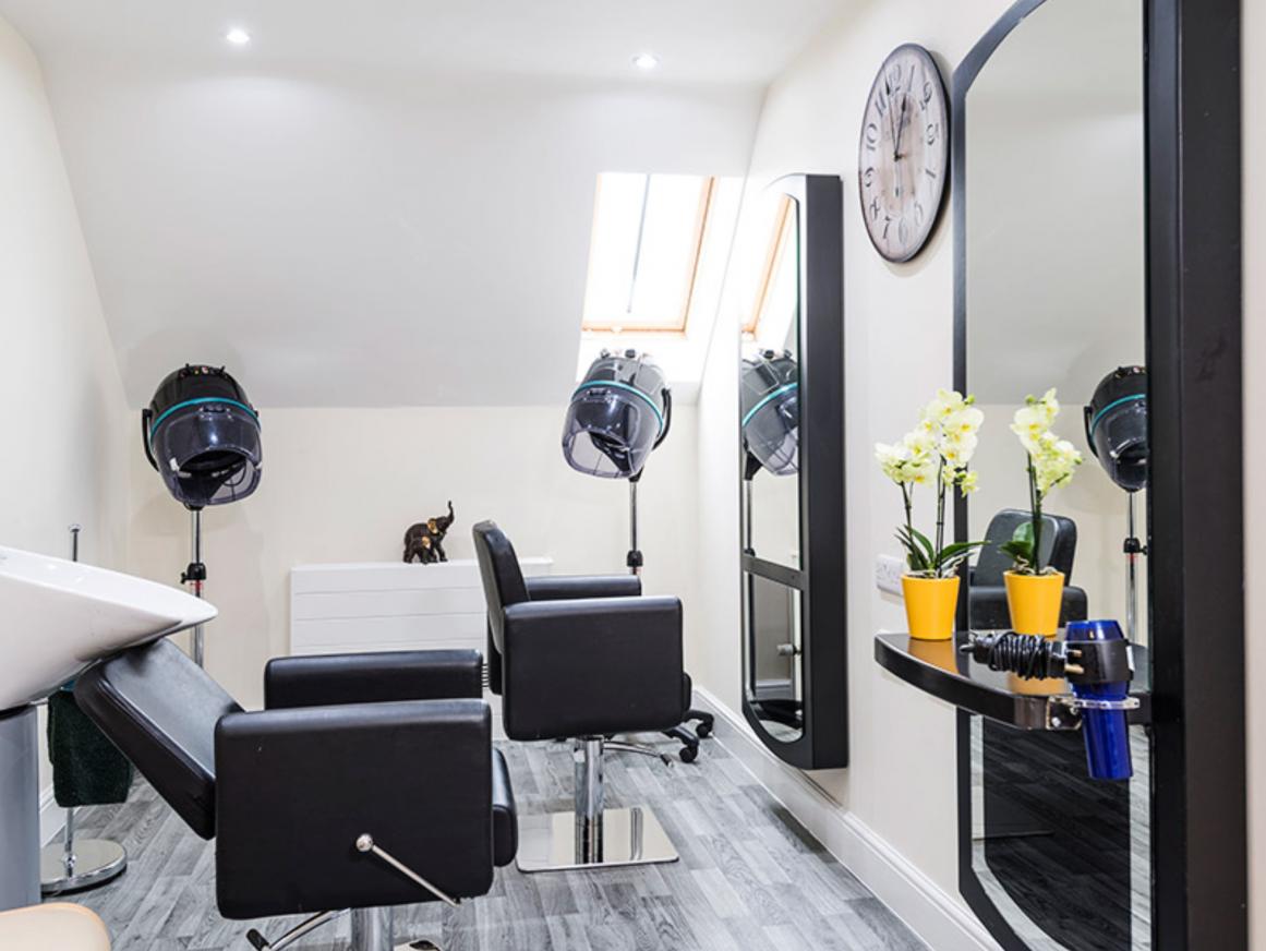 Care home salon with hairdressing stations and tools
