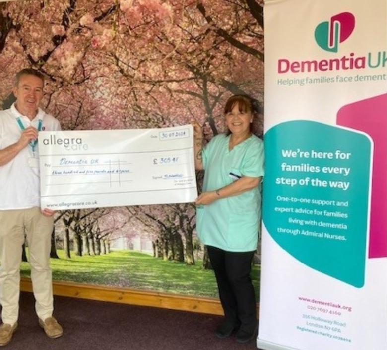 Handing over the large cheque to Dementia UK
