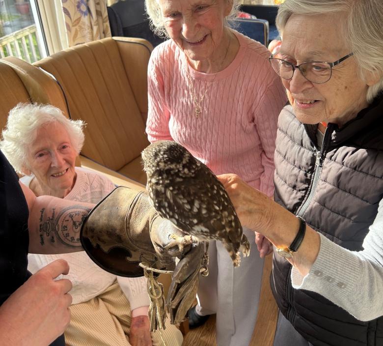 Dunwood Manor residents admiring an owl