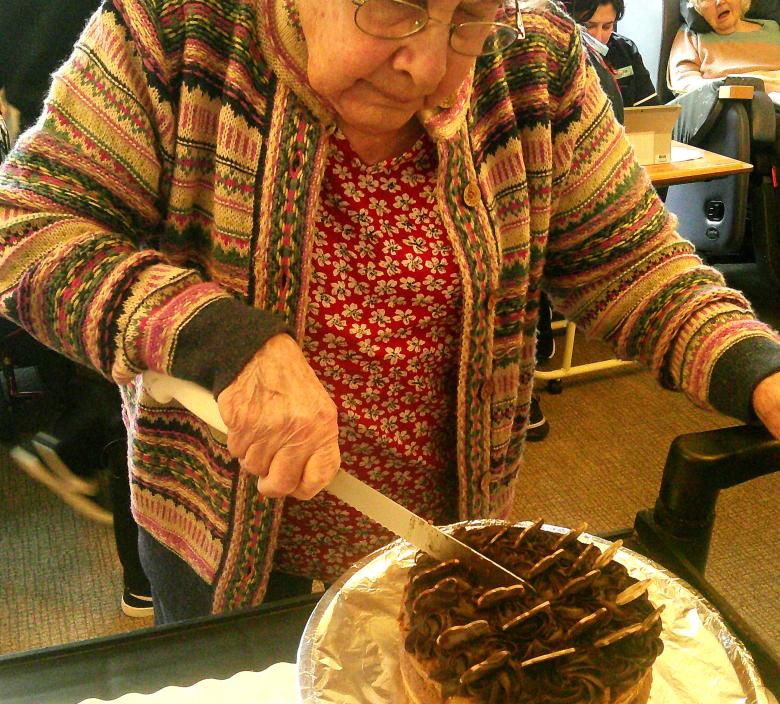 Resident enjoying sampling one of the chocolate cakes