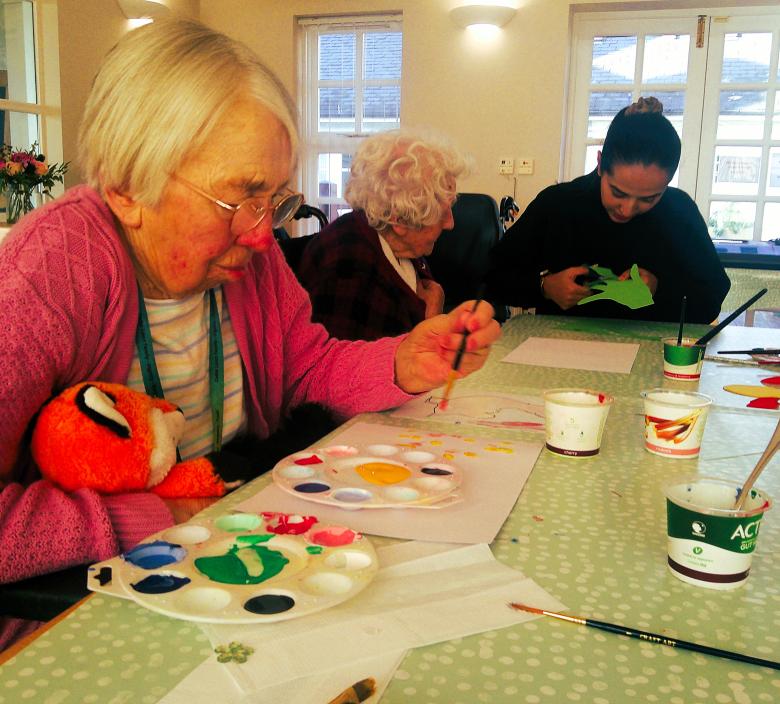 Cedar Lawn Residents enjoying arts and crafts with Meha
