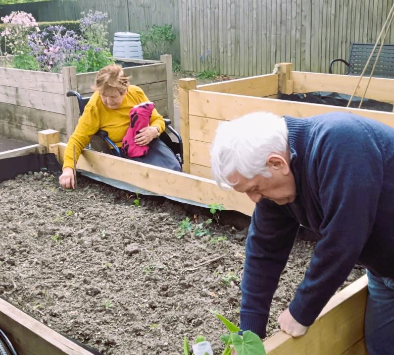 Residents planting vegetable and flowers at Fordingbridge Care Home