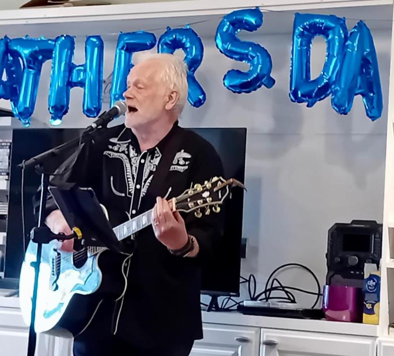 Phil Cowan performing for Fairmile Grange residents