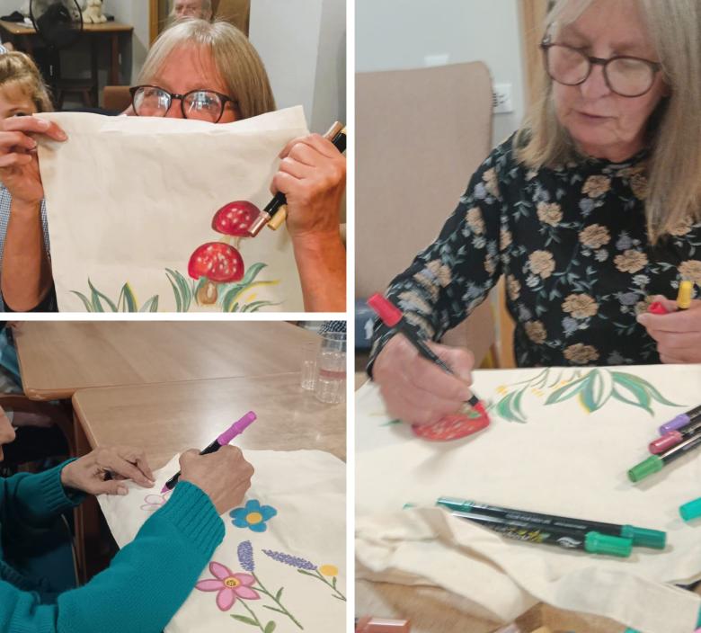Residents painting tote bags