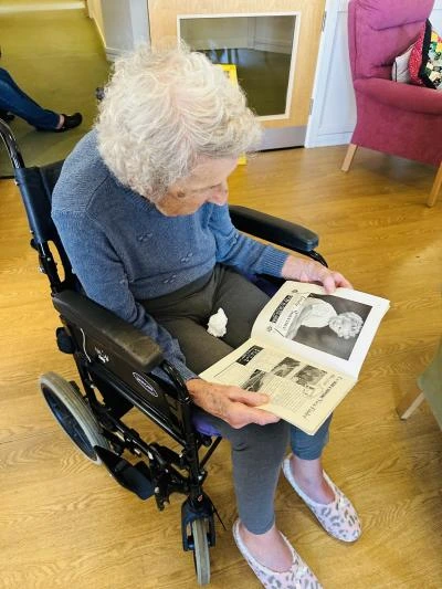 st georges resident reading book at weston museum